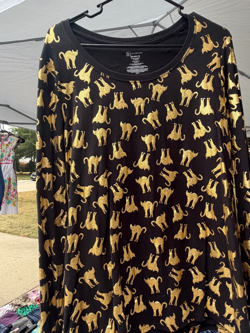 Long sleeved black shirt with gold cats